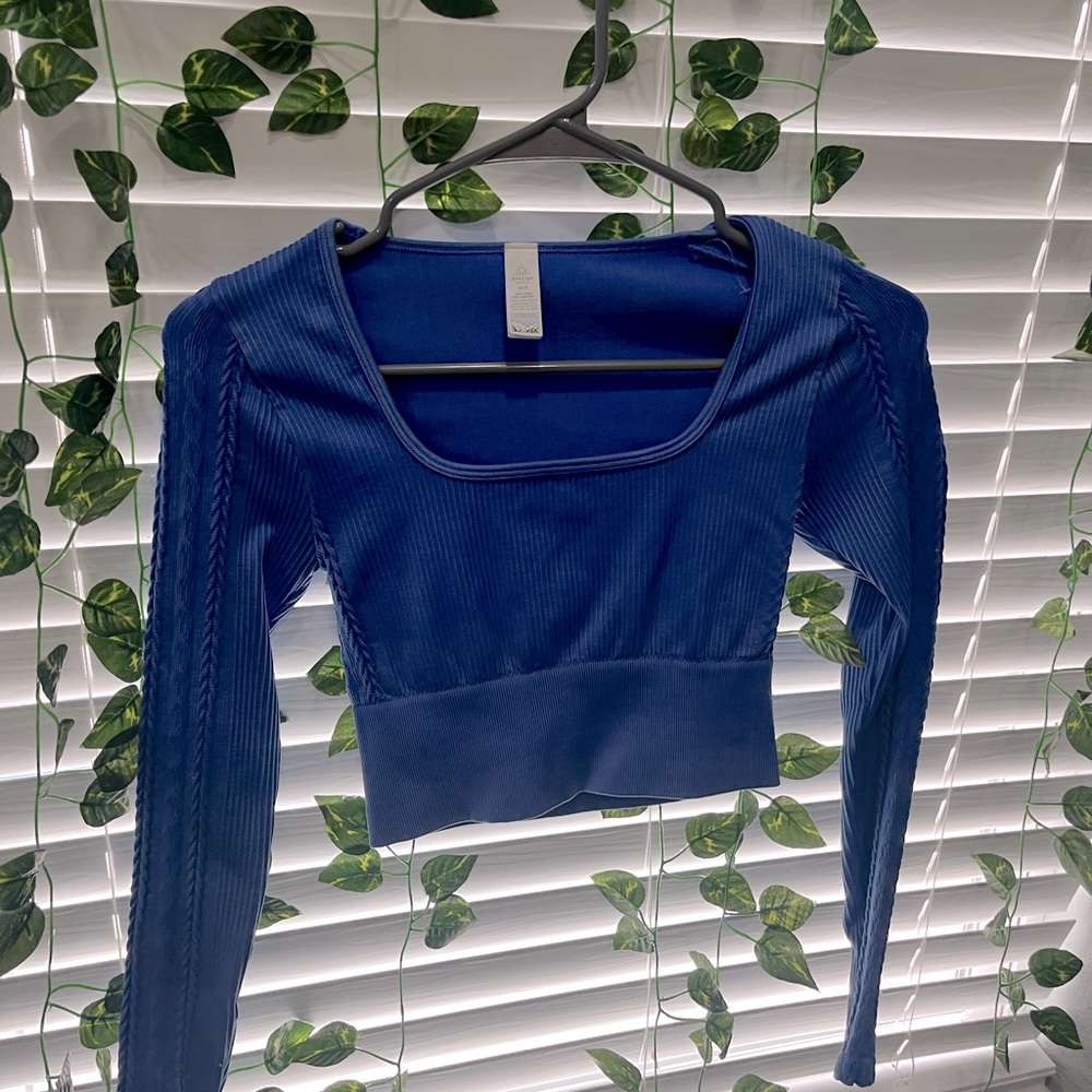 a blue long sleeve women’s top, thick material